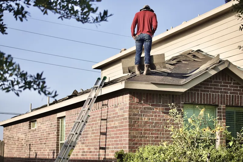 Professional roofer working on a residential roof in San Anselmo